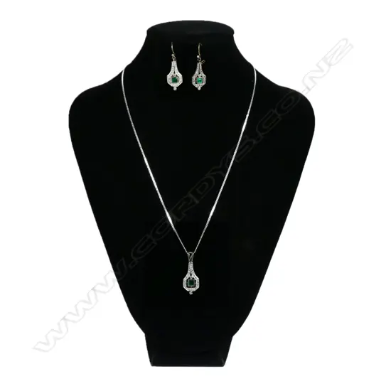 A platinum Art Deco diamond and emerald parure,