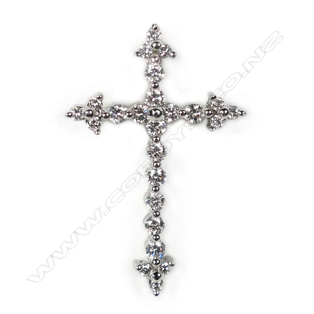 An 18ct white gold and diamond cross pendant, Image 1++
