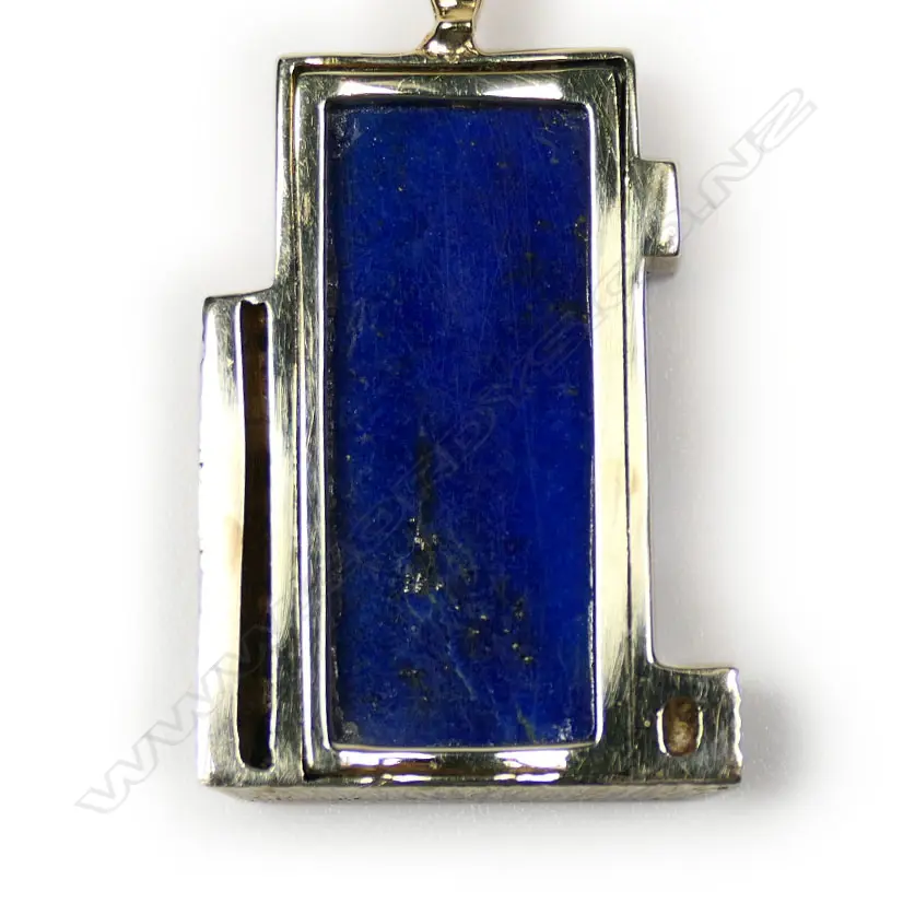 A 14ct yellow and white gold framed lapis lazuli and diamond pendant on chain, Image 1++