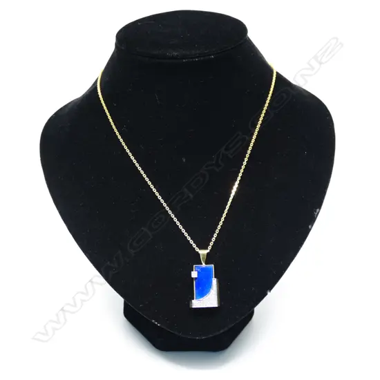 A 14ct yellow and white gold framed lapis lazuli and diamond pendant on chain,