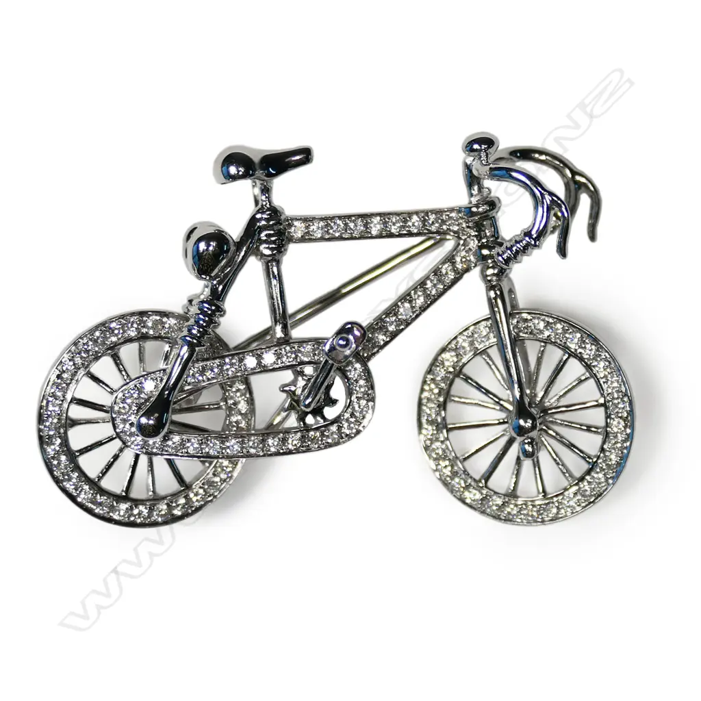 An 18ct white gold and diamond bicycle brooch Image 1++