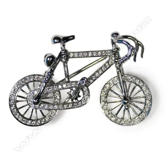 An 18ct white gold and diamond bicycle brooch
