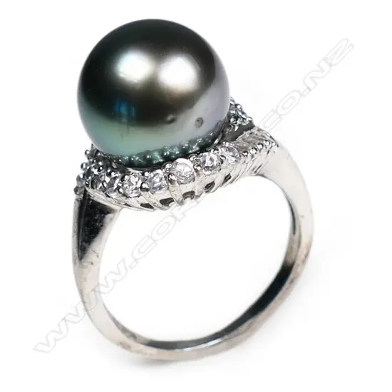 A large South Seas black pearl and silver ring,