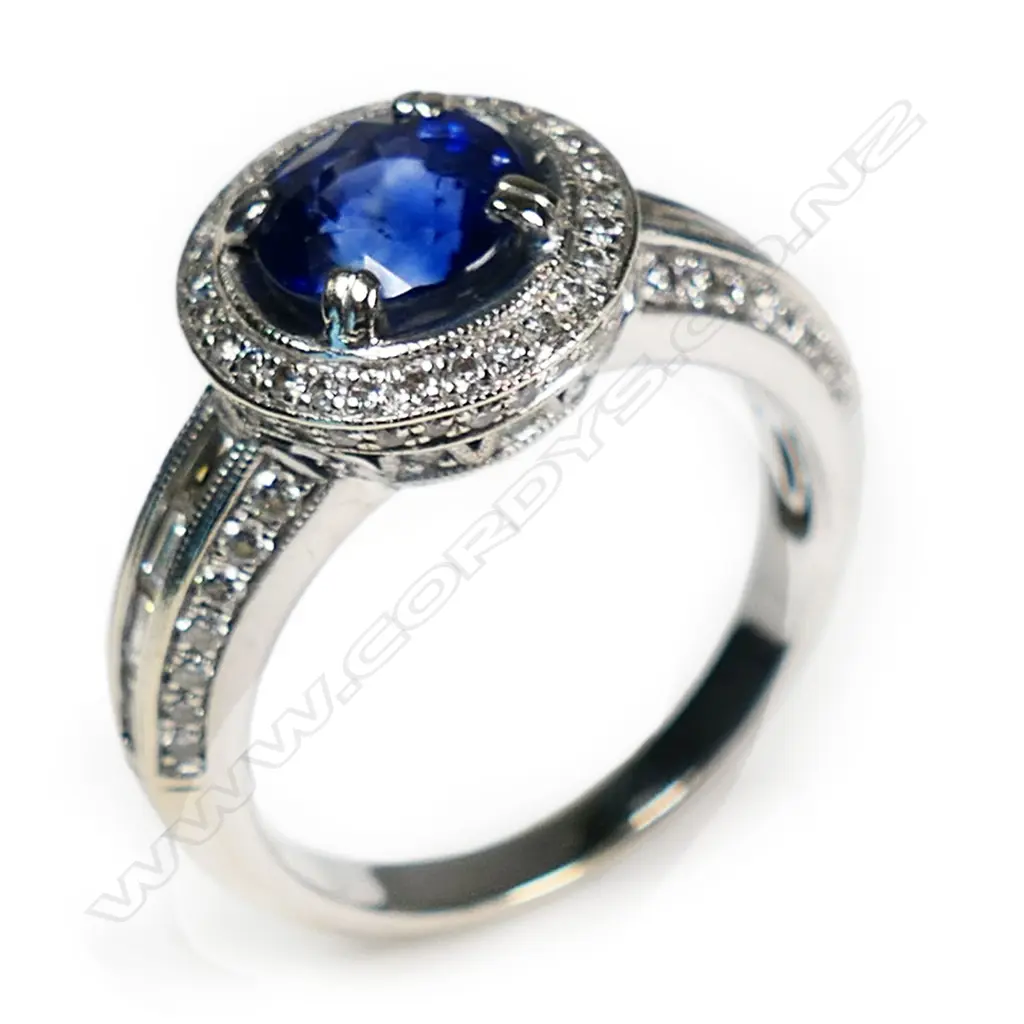 An 18ct white gold diamond and sapphire ring, Image 1++