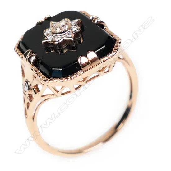 A 14ct rose gold onyx and diamond Art Deco style ring,