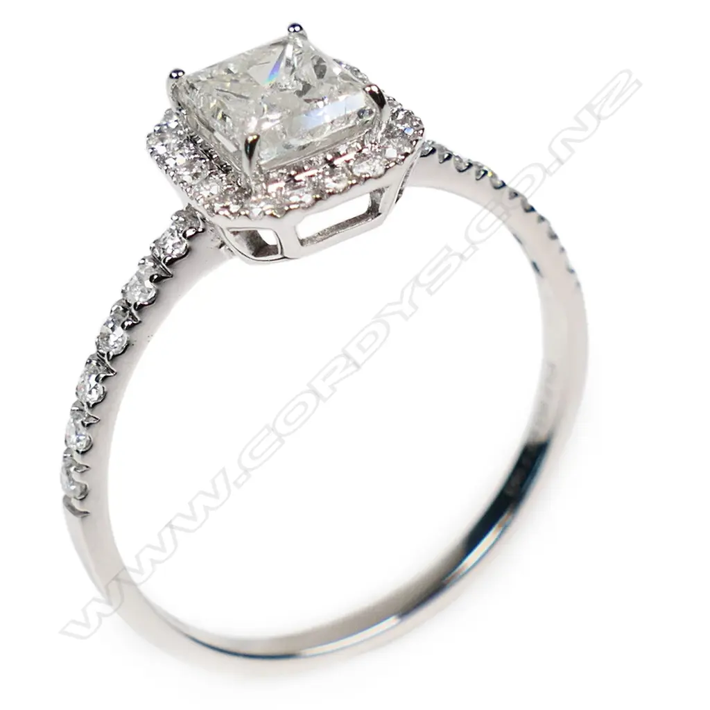 A 14ct white gold and diamond halo ring, Image 1++