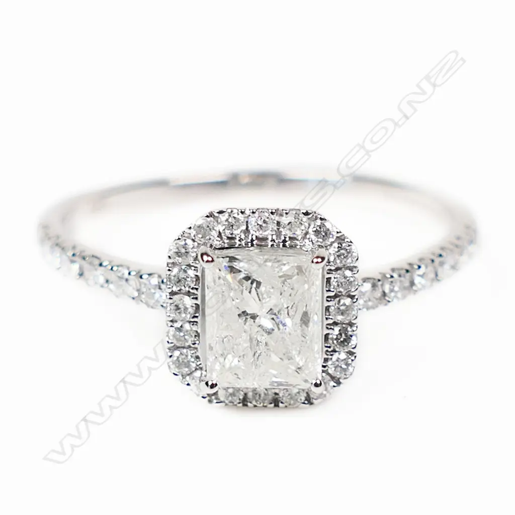 A 14ct white gold and diamond halo ring, Image 1++