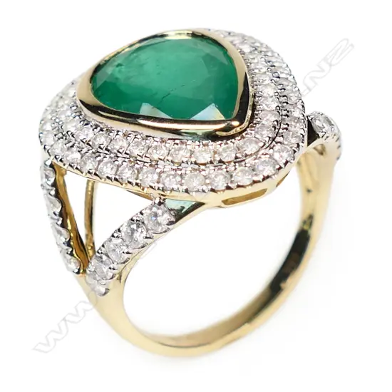 A 14ct yellow and white gold emerald and diamond cocktail ring,