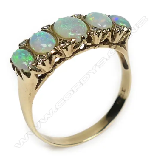 An attractive vintage 9ct yellow gold opal and diamond ring,