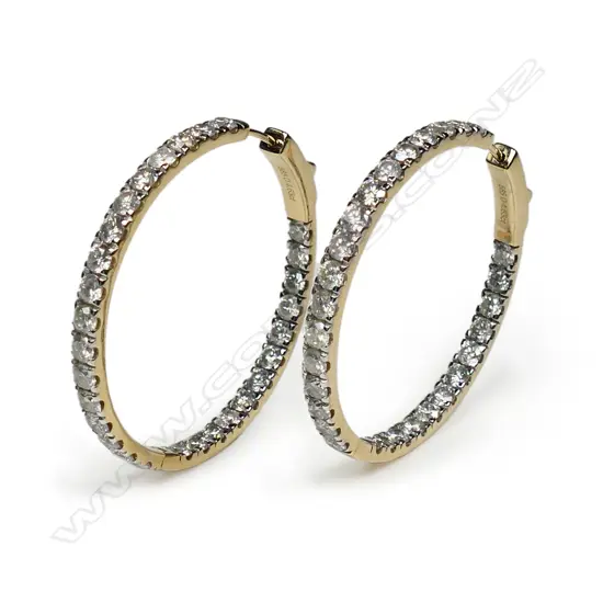 A pair of 14ct gold and diamond hoop earrings,