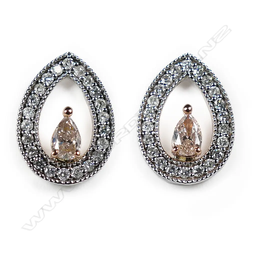 A pair of 14ct white gold pink diamond halo stud earrings, Image 1++