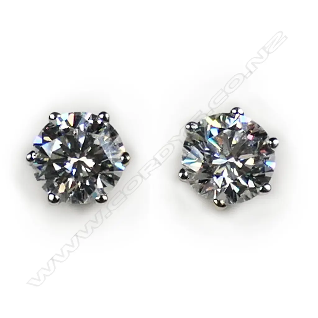 A pair of 18ct white gold and diamond stud earrings, Image 1++