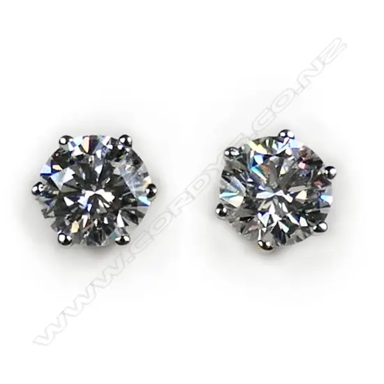 A pair of 18ct white gold and diamond stud earrings,
