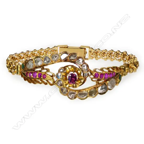 A 22ct gold diamond ruby and emerald bracelet,