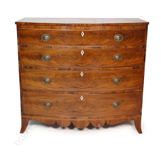 A Georgian bowfront mahogany four drawer chest,