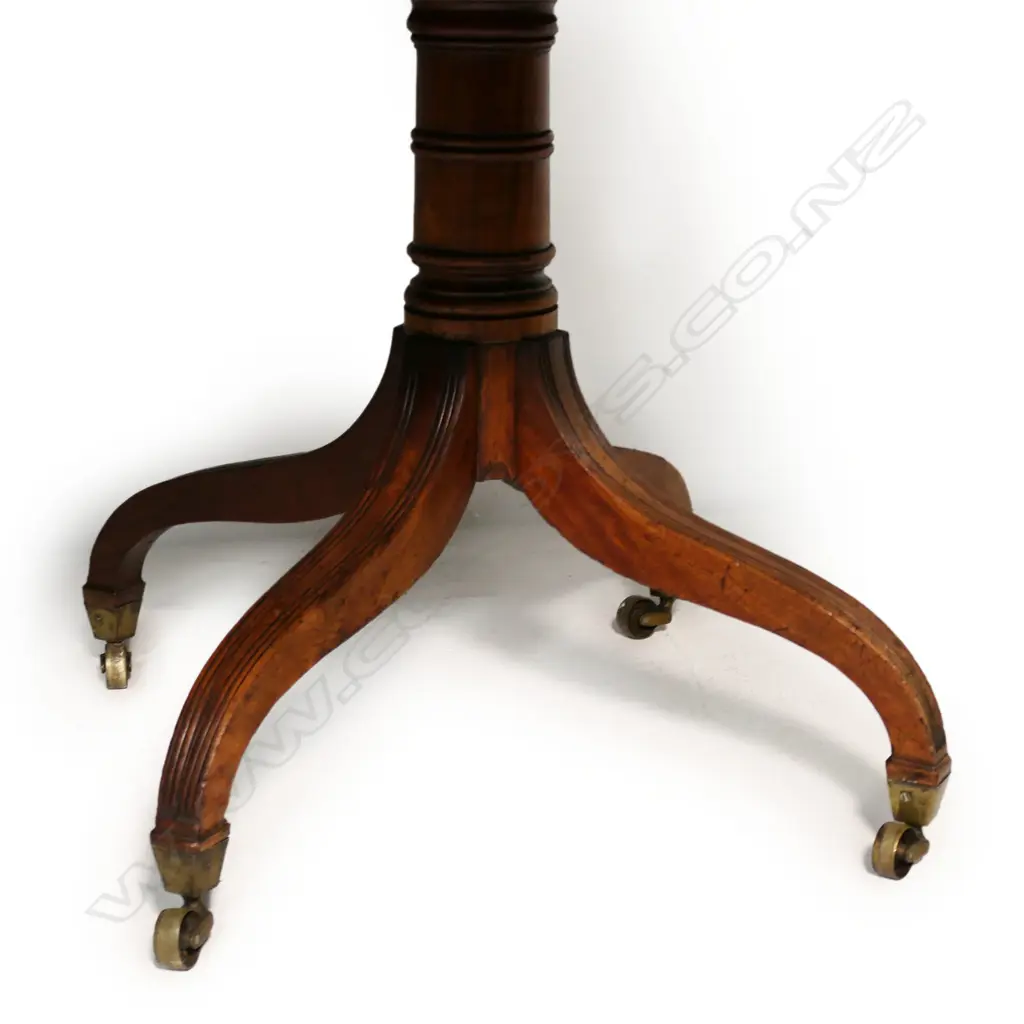 A Regency mahogany double pedestal dining table - with two extension leaves, brass casters. 1500 x 1300 x 730mm (2620mm when extended). Image 1++