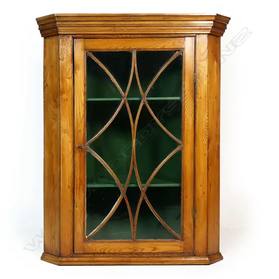 A 19thC country pine corner cupboard,