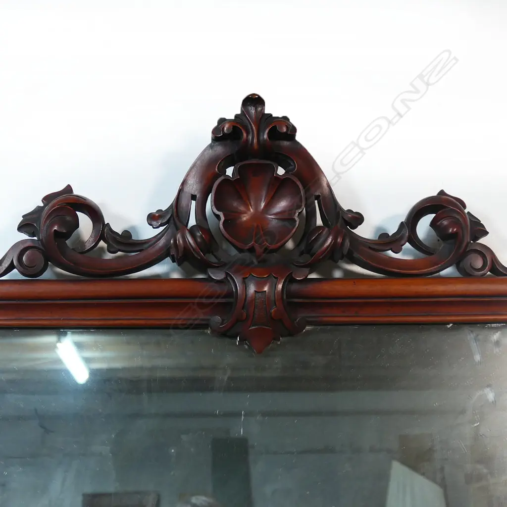 A quality Victorian mahogany mirror back sideboard - carved detail to the mirror back, the base with three drawers over a central cupboard, the side doors open to reveal shelves with one side containing a cellarette, raised on plinth base. 1820 x 580 x 1800mm. Some heat and/or water damage to the top. Image 1++