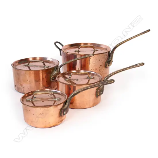 A graduating set of four St. Clair copper lidded saucepans,