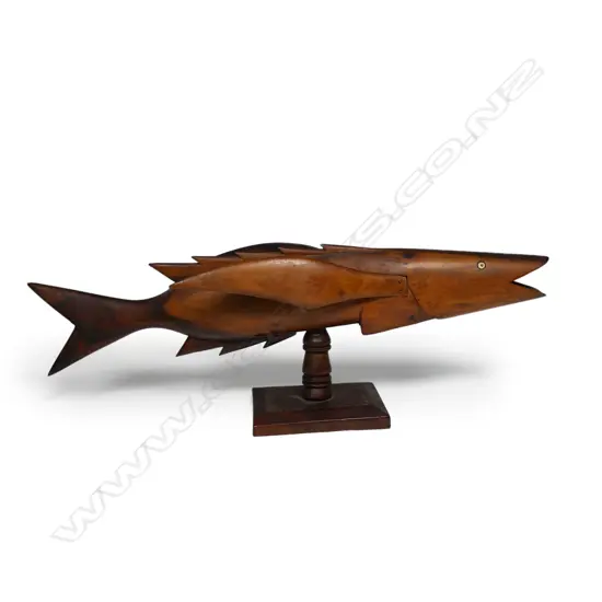 An old Pitcairn Island carved wood flying fish,