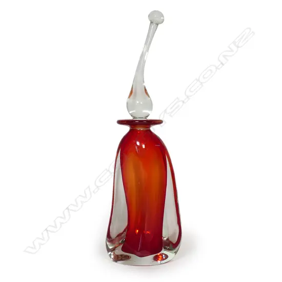A Tom Petit glass bottle and stopper,