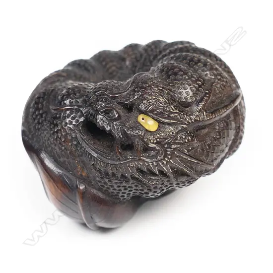 An old wood netsuke study of dragon and pumpkin,