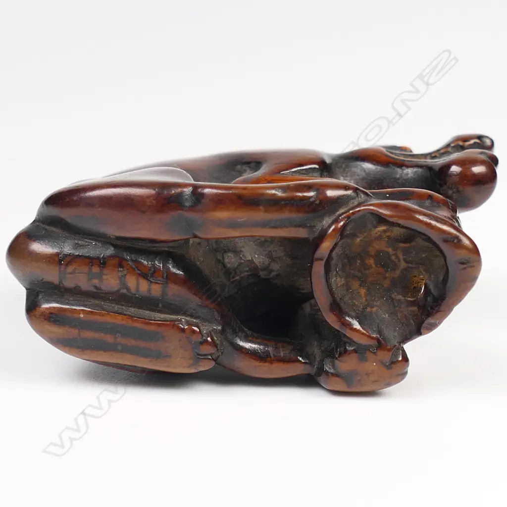 An old carved wood netsuke of a starving wolf, Image 1++
