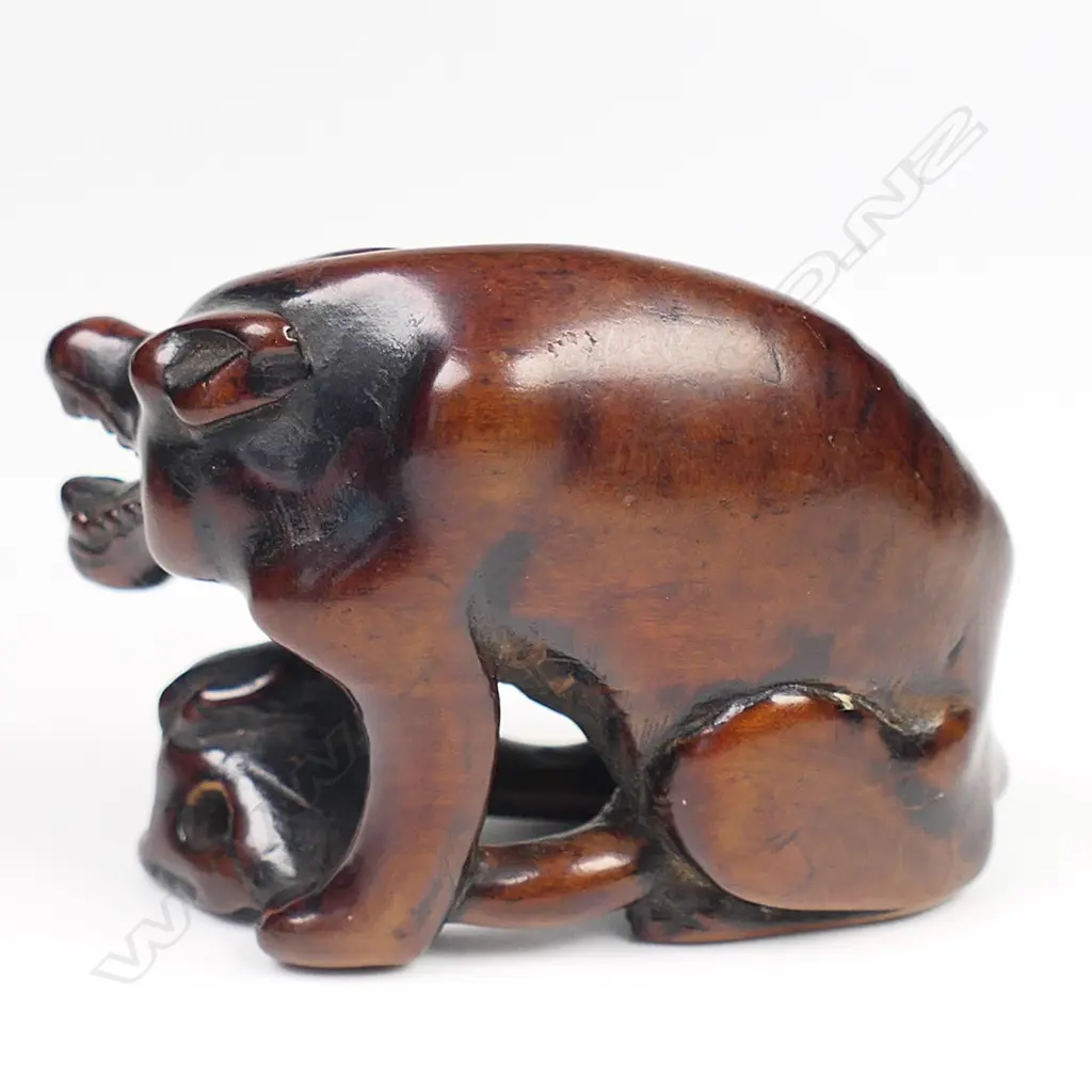 An old carved wood netsuke of a starving wolf, Image 1++