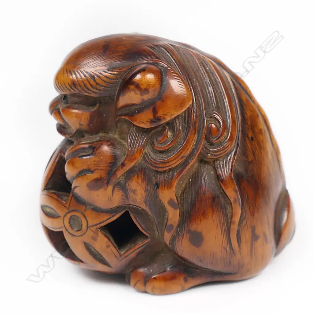 An early 19thC wood netsuke study of a shishi, Image 1++