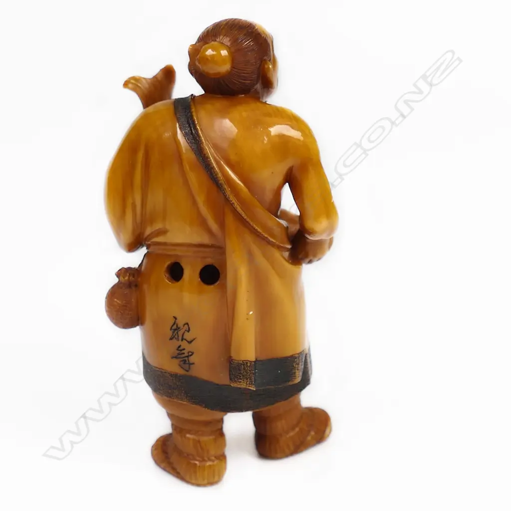 An old stained ivory netsuke of a fisherman, Image 1++