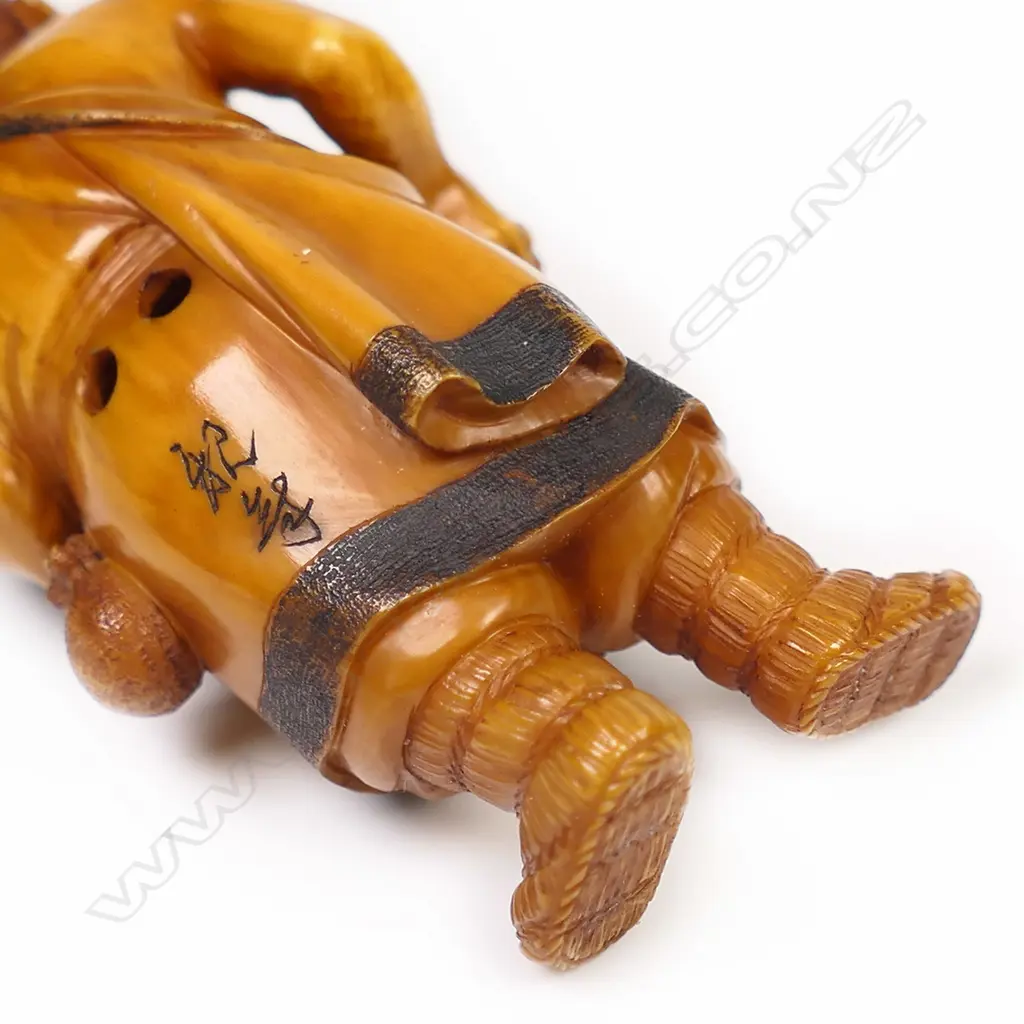 An old stained ivory netsuke of a fisherman, Image 1++