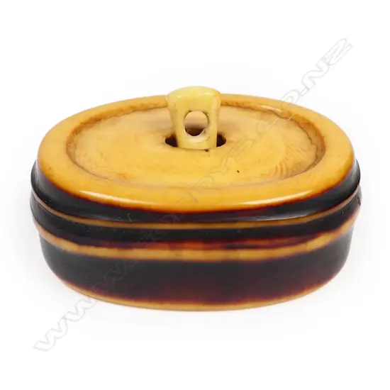 A 19thC stained ivory netsuke study of a bamboo section,