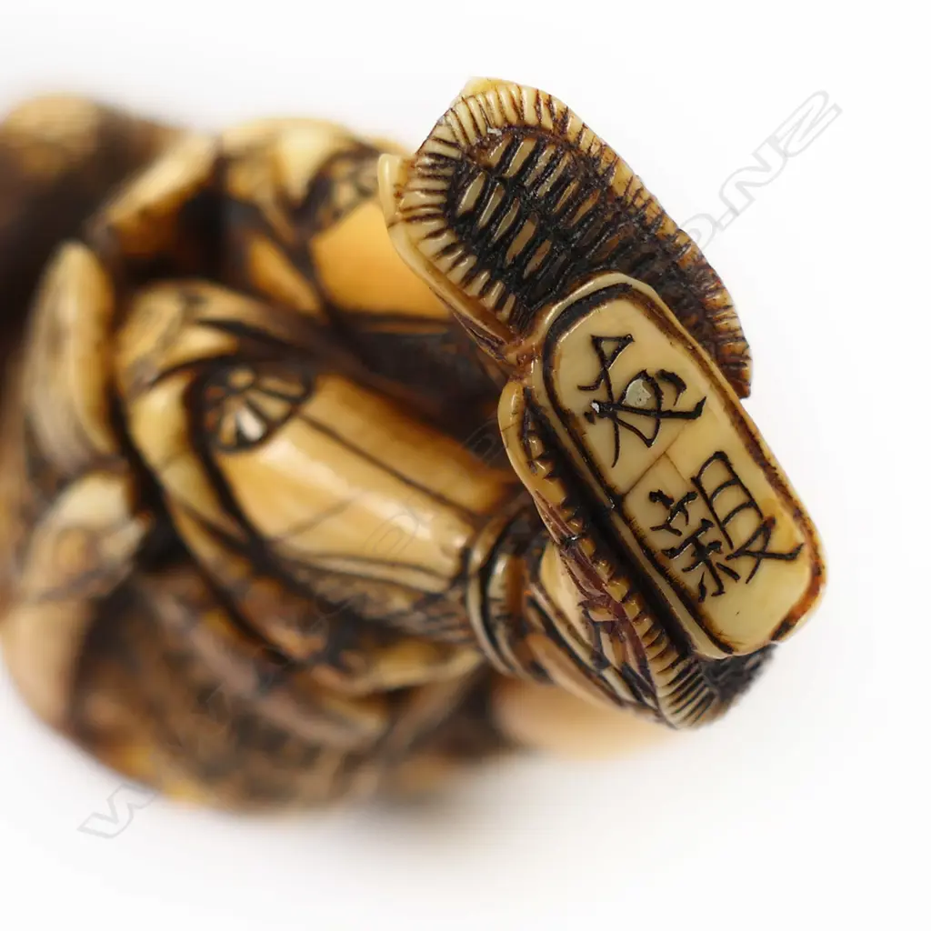An ivory netsuke figure of a warrior, Image 1++