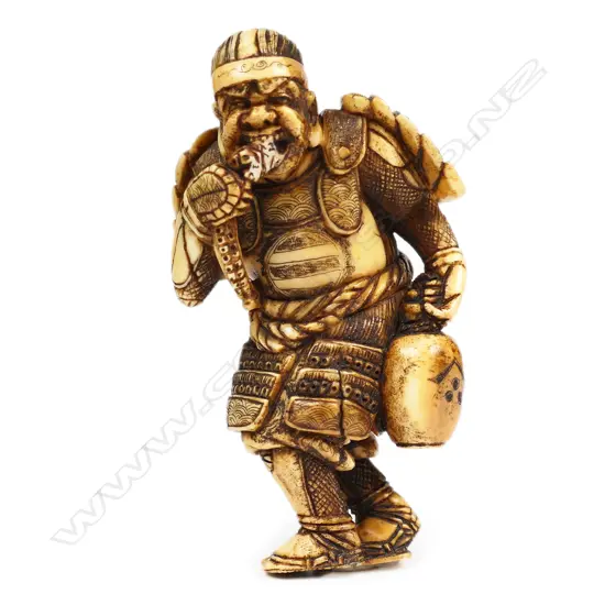 An ivory netsuke figure of a warrior,