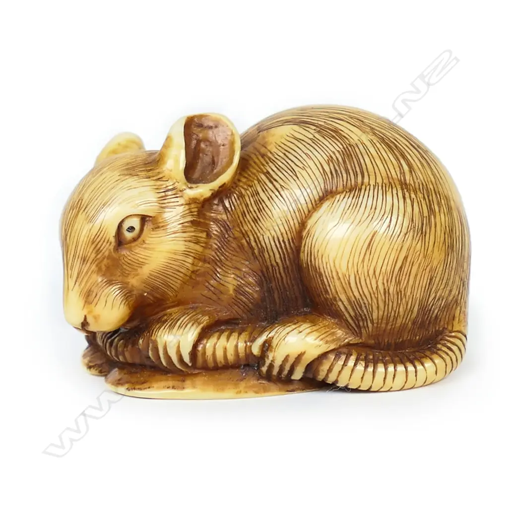 An ivory netsuke study of mouse lying on a fan, Image 1++