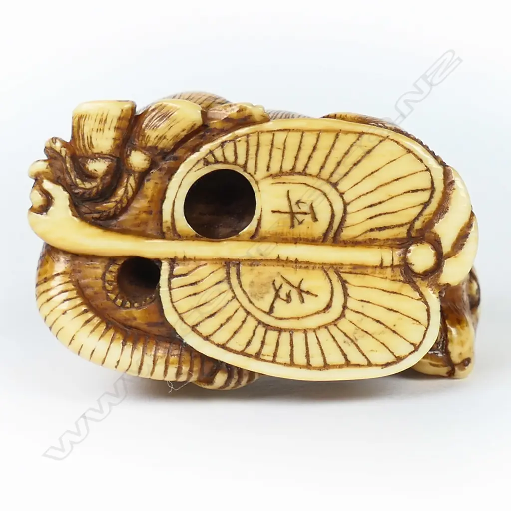 An ivory netsuke study of mouse lying on a fan, Image 1++