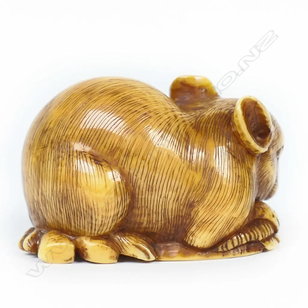 An ivory netsuke study of mouse lying on a fan, Image 1++