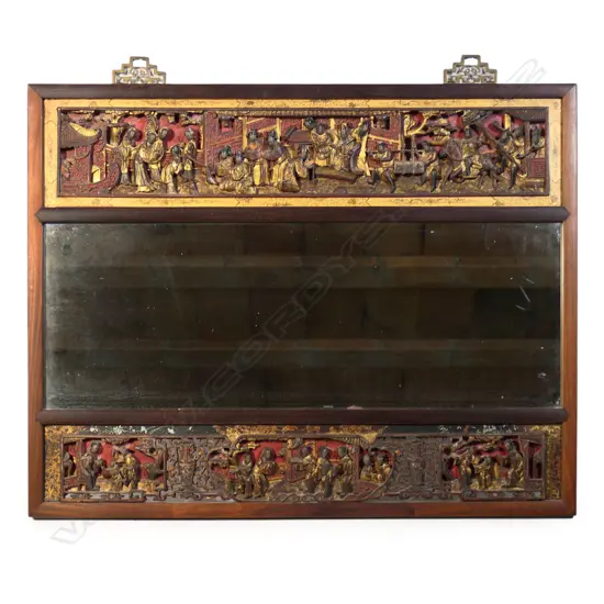 An old Chinese red lacquered carved and gilded framed mirror,