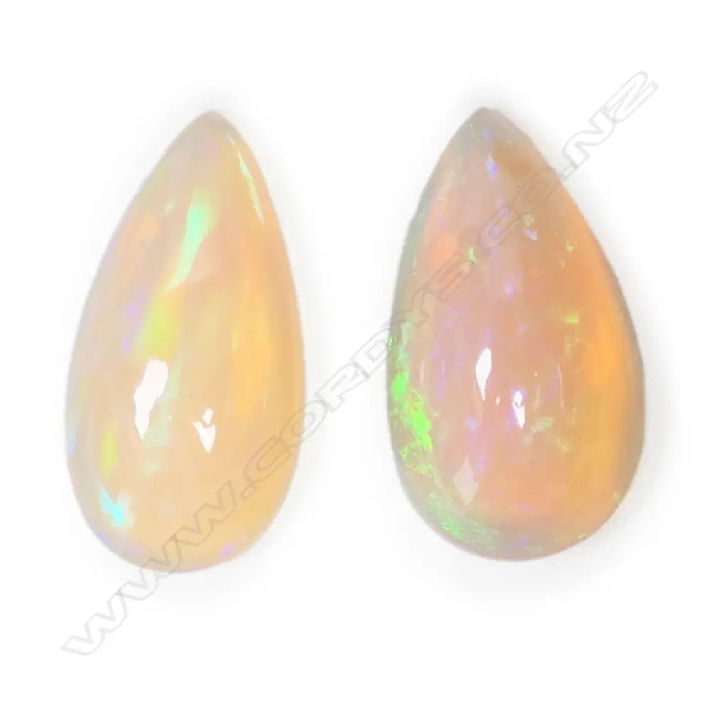 A pair of unset white opals, Image 1++