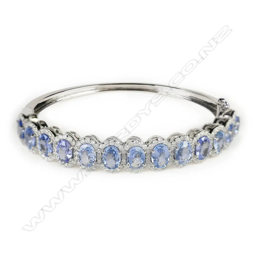 A 14ct white gold, sapphire and diamond halo bangle, Image 1++
