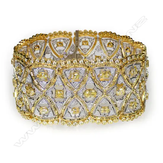 An 18ct yellow and white gold and multi diamond bracelet,