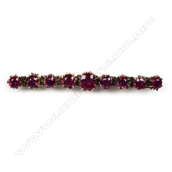 An antique 9ct rose gold and ruby bar brooch,