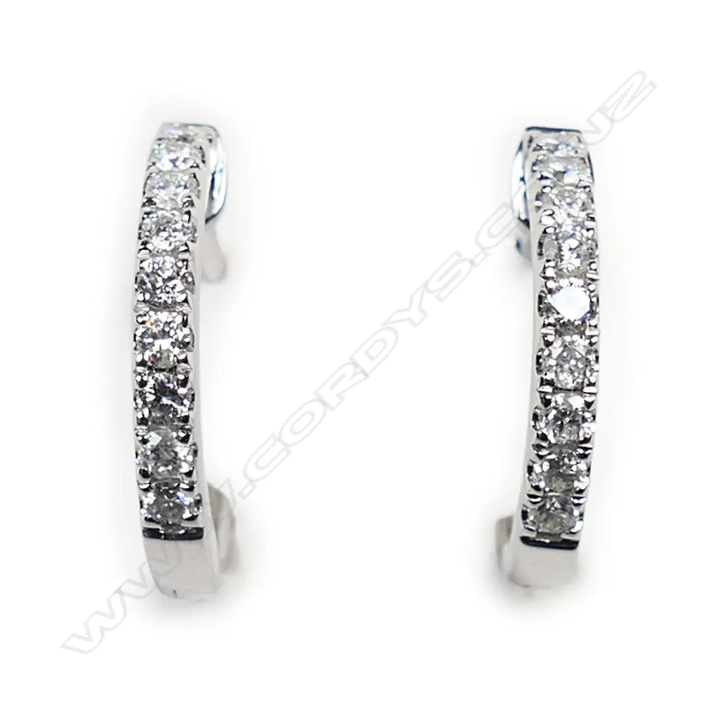 A pair of18ct white gold and diamond huggie earrings, Image 1++
