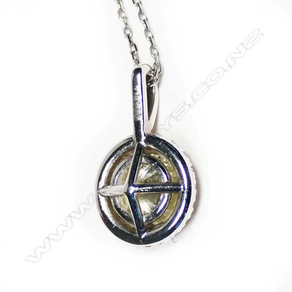 A 14ct white gold and diamond cluster pendant, Image 1++