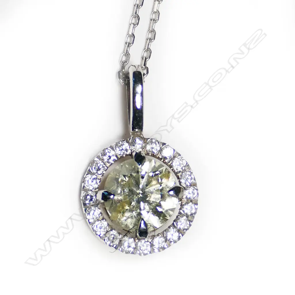 A 14ct white gold and diamond cluster pendant, Image 1++