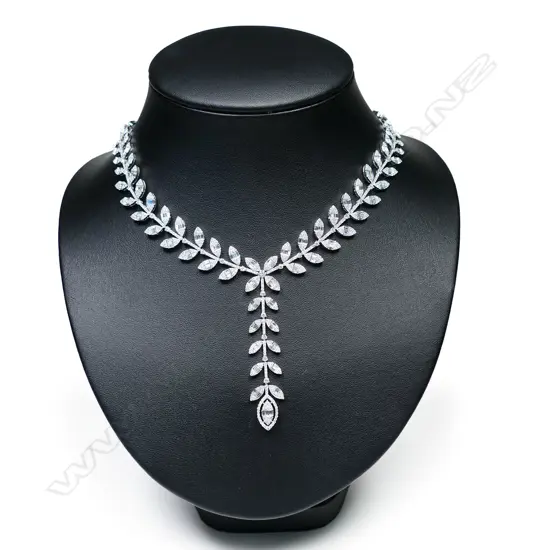 An 18ct white gold and multi diamond leafy vine design necklace,