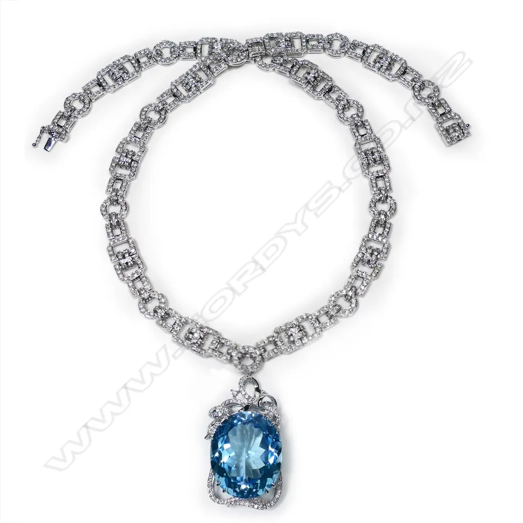 An 18ct white gold blue topaz and diamond pendant necklace, Image 1++