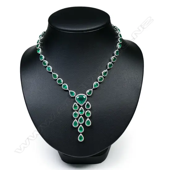 An impressive 18ct white gold emerald and diamond multi stone necklace,