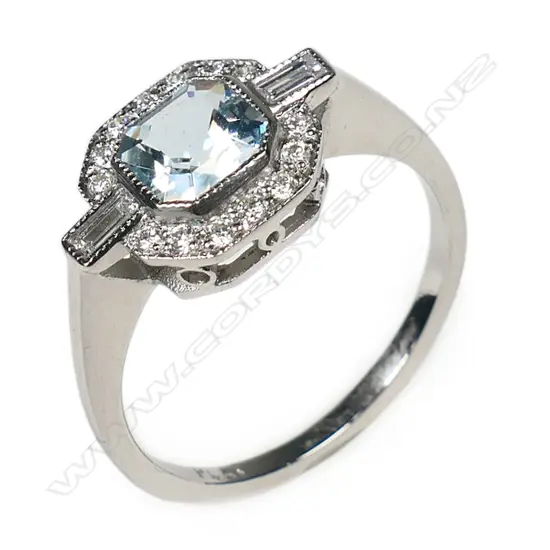 An 18ct white and yellow gold aquamarine and diamond Art Deco style ring,