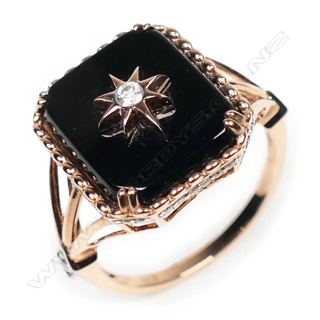 A 14ct rose gold onyx and diamond ring, Image 1++